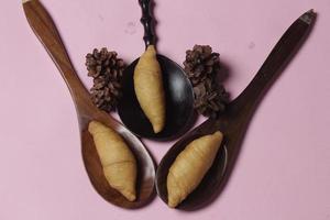 Chocolate bananas from raw materials covered with rolls of pastry dough sheets. Molen bananas with pastries are usually served with a cup of hot coffee or tea. Focus blur photo