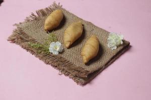 Chocolate bananas from raw materials covered with rolls of pastry dough sheets. Molen bananas with pastries are usually served with a cup of hot coffee or tea. Focus blur photo