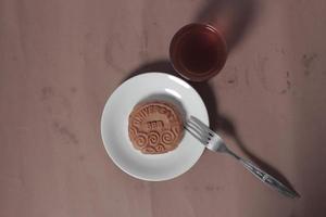 Square-shaped chocolate biscuits are suitable as a side snack to the breakfast menu. Start the morning with biscuits. Can be consumed by all ages from toddlers to the elderly. Stack of biscuits. photo