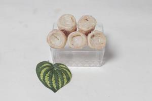 In Indonesia, this cake is known as cumcum cake. A cake shaped like a trumpet, or an ice cream cone. The perfect combination of a dry cake studded with sugar, plus a delicious cream vanilla filling. photo