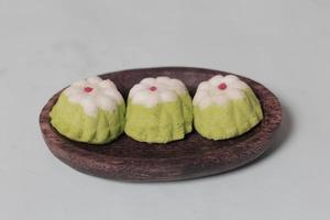 Putu Ayu as a snack in your spare time. Putu Ayu has a soft and tender texture. This putu cake has a very delicious and soft taste when eaten. Indonesian food. Has a pandan scent. Focus blur. photo