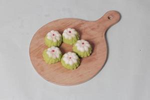 Putu Ayu as a snack in your spare time. Putu Ayu has a soft and tender texture. This putu cake has a very delicious and soft taste when eaten. Indonesian food. Has a pandan scent. Focus blur. photo