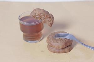 Square-shaped chocolate biscuits are suitable as a side snack to the breakfast menu. Start the morning with biscuits. Can be consumed by all ages from toddlers to the elderly. Stack of biscuits. photo