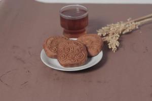 Square-shaped chocolate biscuits are suitable as a side snack to the breakfast menu. Start the morning with biscuits. Can be consumed by all ages from toddlers to the elderly. Stack of biscuits. photo
