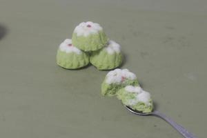 Putu Ayu as a snack in your spare time. Putu Ayu has a soft and tender texture. This putu cake has a very delicious and soft taste when eaten. Indonesian food. Has a pandan scent. Focus blur. photo