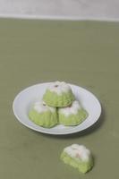 Putu Ayu as a snack in your spare time. Putu Ayu has a soft and tender texture. This putu cake has a very delicious and soft taste when eaten. Indonesian food. Has a pandan scent. Focus blur. photo