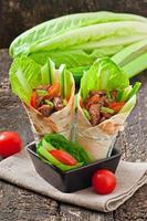 Tortilla wraps with meat and fresh vegetables photo