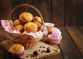 Fruit muffins with nutmeg and allspice on a wooden background photo