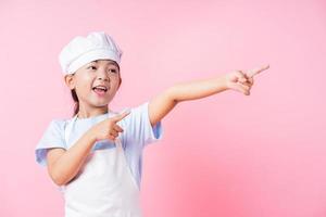 Image of Asian child practicing to be a chef photo