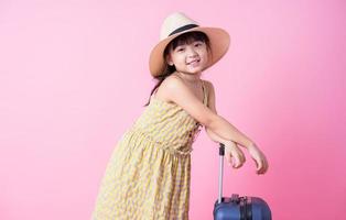 Image of Asian child with suitcase, summer concept photo