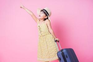 Image of Asian child with suitcase, summer concept photo