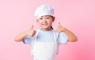 Image of Asian child practicing to be a chef photo