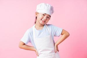 Image of Asian child practicing to be a chef photo