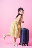 Image of Asian child with suitcase, summer concept photo