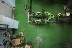 Green pipeline and valve equipment for water supply system control room photo