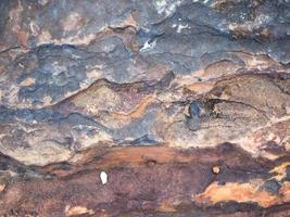 detalle de la superficie de la textura de piedra antigua, resumen de fondo foto