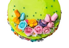 Top view Closeup Green apple jam cake decorations with Colorful Icing fruits photo