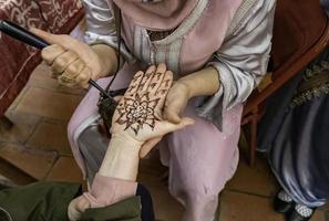 Henna tattoo on the hand photo