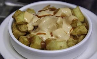 Plate of bravas potatoes photo