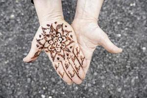 Henna tattoo on the hand photo