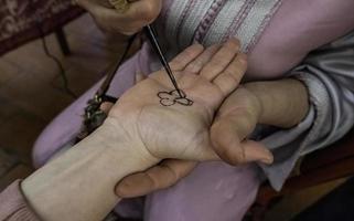 Henna tattoo on the hand photo