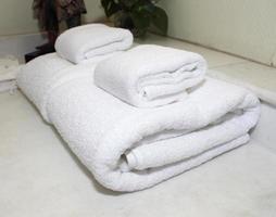 Stacked white spa towels photo
