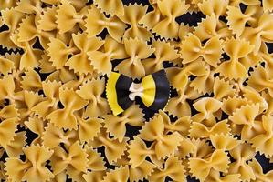 Mixed colorful farfalle pasta. Flat lay. Top view. photo