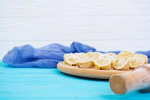 Homemade raw dumplings, pelmeni, on wooden background. photo