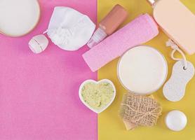 Set cosmetics SPA.  Mockup on pink-yellow background, place you design. Top view