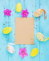 Easter background with flowers and easter eggs. Top view photo