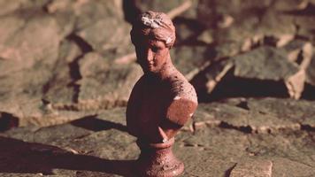 ancient statue of woman on rocky stones video