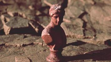 ancient statue of woman on rocky stones video