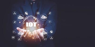 Businessman hand shows a block diagram of internet of things .  New Technologies and Business Process Strategies, Operations Automation, Customer Service Management, Cloud Computing. photo