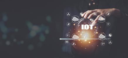 Businessman hand shows a block diagram of internet of things .  New Technologies and Business Process Strategies, Operations Automation, Customer Service Management, Cloud Computing. photo