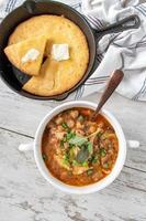 hearty vegetable soup with carrots, leeks, and black beans in beef broth flat lay photo