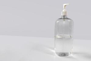hand sanitizer bottle with no label on clean background with copy space photo