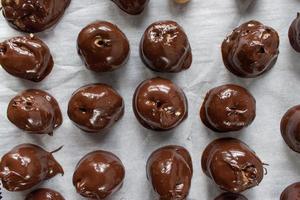 holiday homemade chocolate covered peanut butter balls flat lay photo