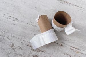 running out of supplies with top view of empty toilet paper rolls photo