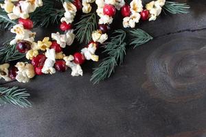 Christmas garland of red cranberries and popcorn kernels with copy space photo