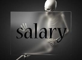 salary word on glass and skeleton photo