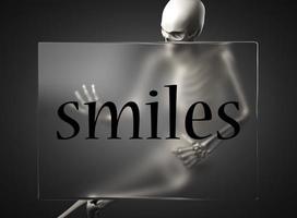 palabra de sonrisas en vidrio y esqueleto foto