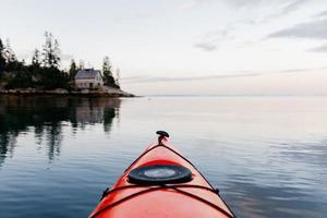 Red kayak in the water photo