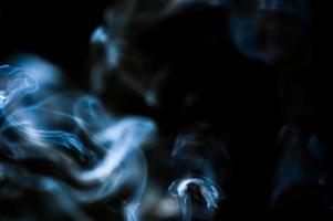 abstract background of smoke or fog on black background photo