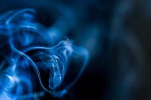 abstract background of smoke or fog on black background photo