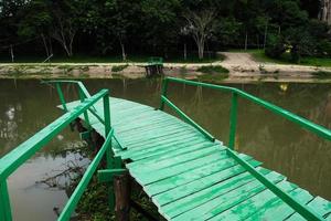 A wooden bridge that collapsed due to the violent flooding. photo