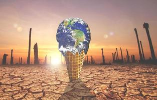 The concept of global warming and environmental change. Melting world on ice cream cone photo