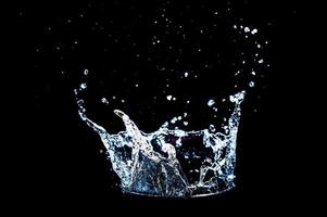 Abstract background of Water splashing on a black background. idea for freshness photo