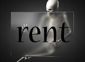 rent word on glass and skeleton photo