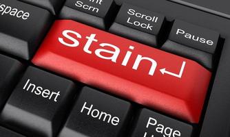 stain word on red keyboard button photo