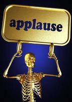 aplausos palabra y esqueleto dorado foto